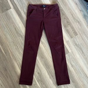 AE stretch maroon skinny trousers